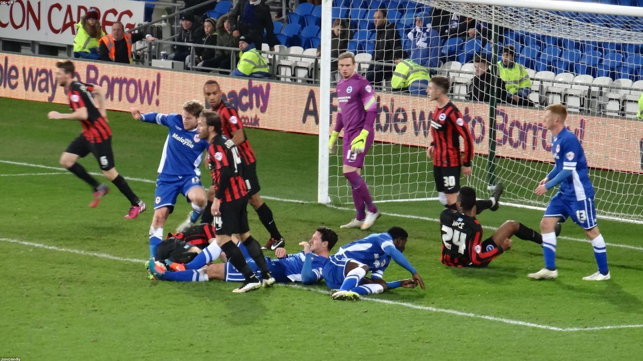 SoFi Stadium exterior lit by late afternoon sun.